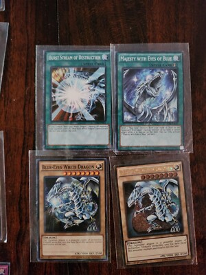 100+Yu-Gi-Oh cards Blue eyes white dragon most with sleeves, rare-image