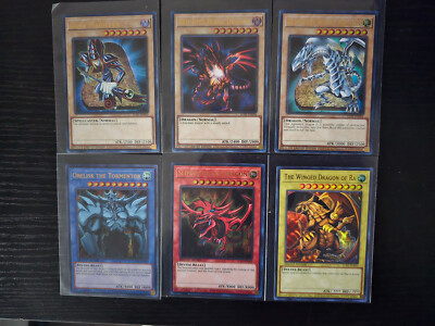 YuGiOh 25TH ANNIVERSARY PROMO GOD CARD RA SLIFER OBELISK BLUE RED EYES LC01🔥-image