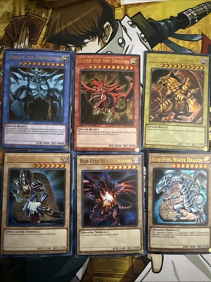 YuGiOh 25TH ANNIVERSARY PROMO GOD CARD RA SLIFER OBELISK BLUE RED EYES LC01🔥-image